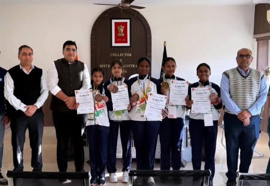 District Collector honouring Asmita Khelo India medal winners
